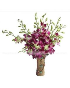 ORCHID FLOWERS IN GLASS VASE